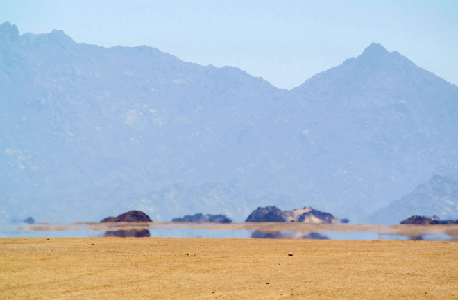 desert mirage mountains in the background