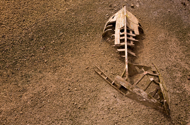 An old boat washed up on the shore