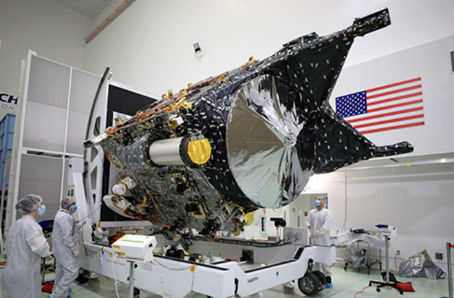 Workers at a facility near Florida’s Kennedy Space Center attend to NASA’s Psyche spacecraft in late 2022.