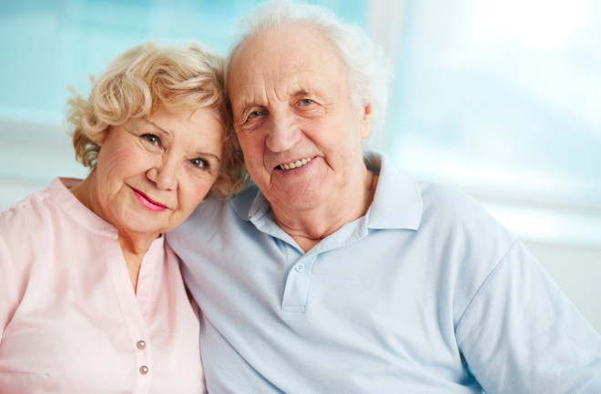 elderly couple smiles