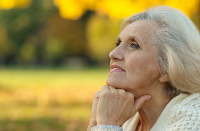 older woman park autumn - shutterstock