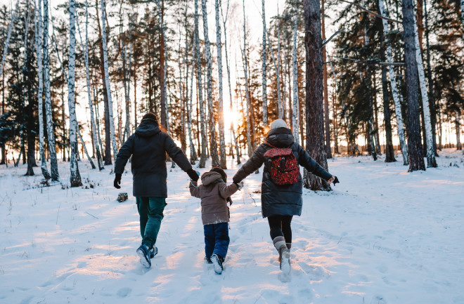 family in the snow - shutterstock 1873344160