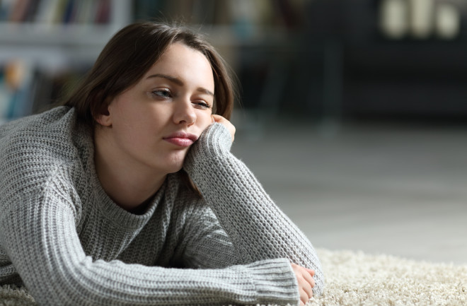 Teen looking bored