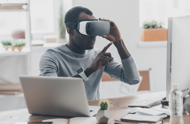 A man using a virtual reality headset for work