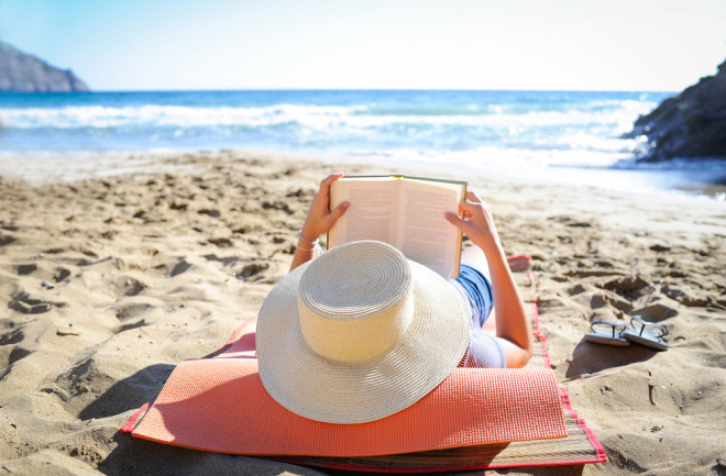 beach reading a book - shutterstock 615571835