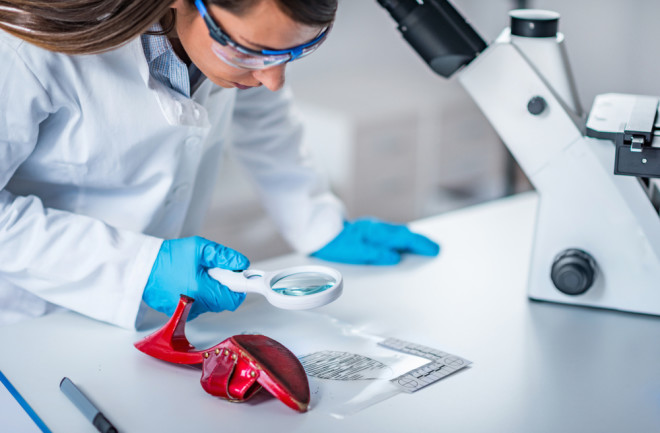 Forensic science expert examining objects from a crime scene