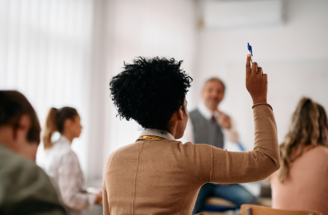 student-raising-hand-in-class